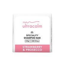 Load image into Gallery viewer, A white shampoo bar package featuring a pink and black label with the brand name "Ultracalm." The label states "Ultracalm 50mg CBD Shampoo Bar 100g" and lists details such as "CBD 50mg." Infused with natural essential oils, the product is described as having a "Strawberry & Prosecco" flavor.