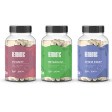 Load image into Gallery viewer, Three bottles of Hembiotic 5000mg Bulk CBD Capsules - 200 Caps by Hembiotic are shown: Immunity (red), Metabolism (green), and Stress Relief (blue). Each lab-tested bottle offers targeted wellness support.
